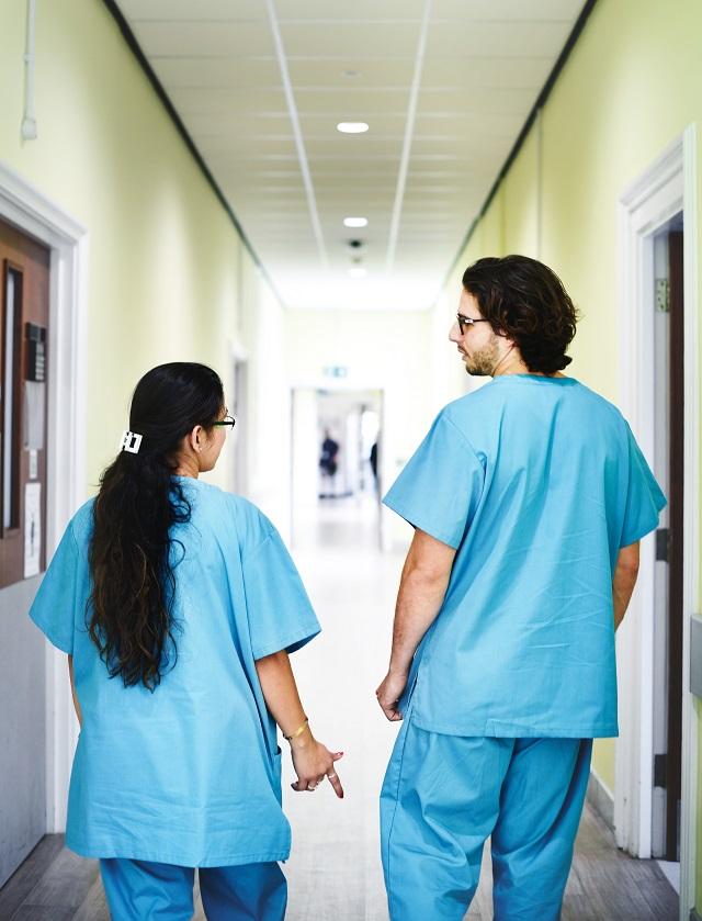 Two persons in scrubs
