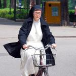 Nun on a bike